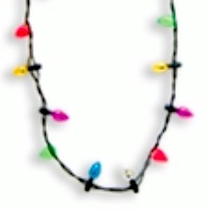 NWT TWINKLING TREASURES blinking light bulb necklace
